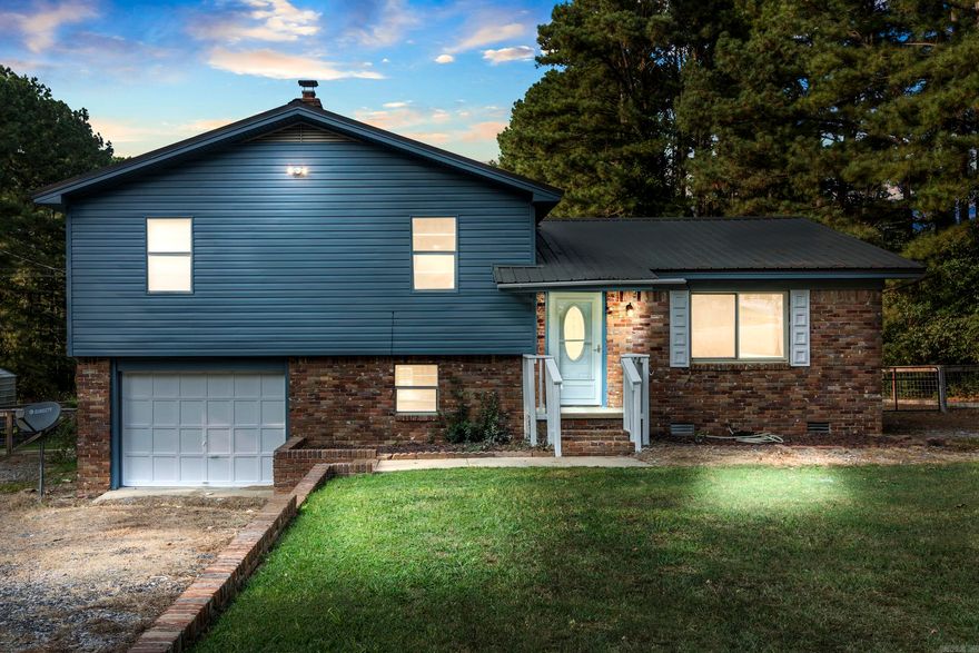 Newly painted home with almost 2 acres, an above ground swimming pool, and hot tub! This home also has a bonus room downstairs that could be used as an additional bedroom or office space.