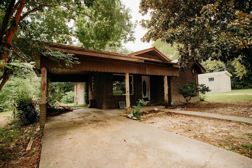 Investor Special or Perfect Starter Home! This 2 bedroom, 1 bathroom brick home offers 1,151 sq ft of potential, ready for your personal touch. Featuring a new metal roof and sitting on a .59 acre lot, there’s plenty of space for outdoor living, gardening, or future expansion. While it’s in need of some updates, this fixer-upper is a great opportunity for investors or a small family looking to create their dream home. This home is being sold AS-IS. AGENTS SEE SHOWING REMARKS.