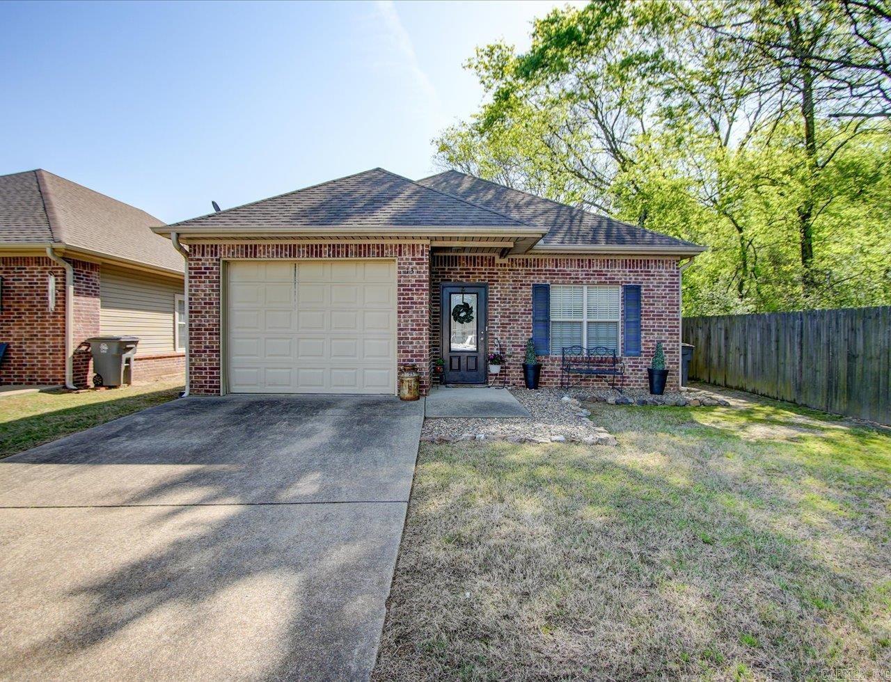 Welcome to easy living in this beautifully maintained 2Bd/2Ba home in Golf Links Gardens. Whether youāre looking to downsize, retire in comfort, or enjoy a peaceful second home near the lakes, this move-in ready gem checks all the boxes. Step inside to discover a bright, open-concept layout with plenty of natural light and a cozy yet spacious living area perfect for relaxing or entertaining. The kitchen features modern appliances, a pantry closet and over-sized "farm" sink. The primary suite offers a private retreat with a full ensuite bath, while the second bedroom is ideal for guests or a home office. Outside, enjoy your own low-maintenance garden space with a private patioāperfect for morning coffee or evening unwinding. Additional perks include an attached 1-car garage & floored attic space that could be converted into a 3rd bedroom. Located just a short drive from Lake Hamilton, and all Hot Springs has to offer, this home offers the perfect balance of convenience and tranquility.