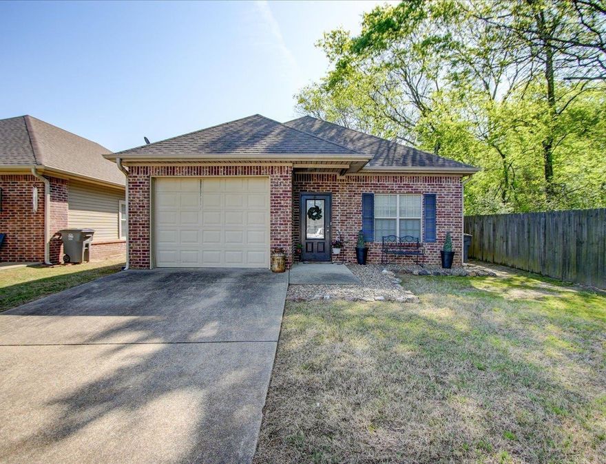 Welcome to easy living in this beautifully maintained 2Bd/2Ba home in Golf Links Gardens. Whether you’re looking to downsize, retire in comfort, or enjoy a peaceful second home near the lakes, this move-in ready gem checks all the boxes. Step inside to discover a bright, open-concept layout with plenty of natural light and a cozy yet spacious living area perfect for relaxing or entertaining. The kitchen features modern appliances, a pantry closet and over-sized "farm" sink. The primary suite offers a private retreat with a full ensuite bath, while the second bedroom is ideal for guests or a home office. Outside, enjoy your own low-maintenance garden space with a private patio—perfect for morning coffee or evening unwinding. Additional perks include an attached 1-car garage & floored attic space that could be converted into a 3rd bedroom. Located just a short drive from Lake Hamilton, and all Hot Springs has to offer, this home offers the perfect balance of convenience and tranquility.
