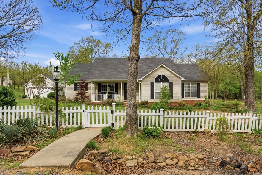 HOME WITH 5 ACRES IN WEST CONWAY! Y'all this one is HARD to find. This 3 bed/2 bath home offers 1620sq ft. with an open concept layout connecting the kitchen,dining,and living areas.  The kitchen features white cabinetry, quartz countertops, and a large breakfast bar ideal for everyday living and entertaining. The property includes a 720sq ft detached garage/shop with upstairs storage w/ lean to for additional equipment or lawn storage. New paint throughout including garage. Enjoy peaceful evenings on the back deck complete with a pergola. The home is currently on well water w/ septic.  Conway Corp water line has recently been run to the property w/ meter, offering option to connect to city water.  Roof approx 8 yrs old, HVAC 6, Water heater 3. Acreage, privacy and convenience. This property offers all of it within the city limits.