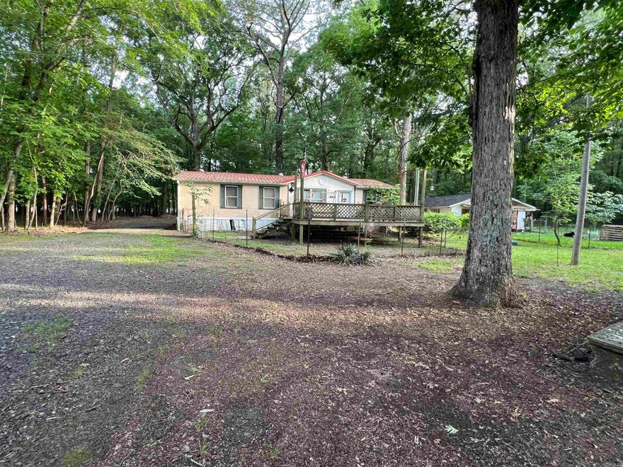 Nice flat lots to build on. utilities on the property. There is a mobile home (double wide) that has no value. If you enter the Mobile Home, you are entering at your own risk. No repair concessions will be given. Approximately 2.5 lots are being sold see photo for lot sizes. New survey is suggested. In the survey it shows Jackson Loop dissecting the lots and this road isn’t there. All lots are connected.