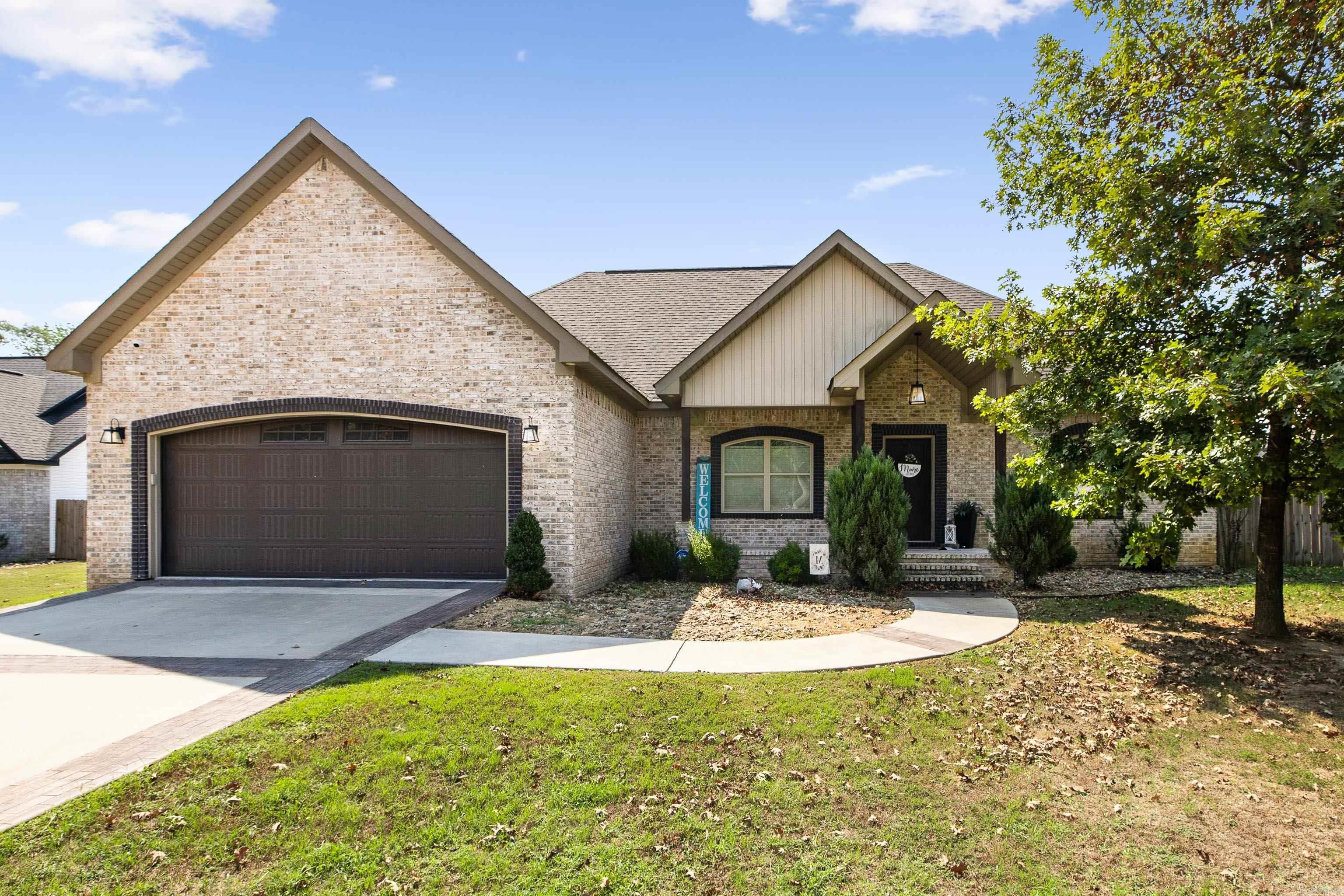 This like-new home is a must-see! Nestled in a quiet neighborhood, it welcomes you with a covered front porch and an open layout inside featuring tall ceilings, a cozy gas fireplace, and a spacious kitchen with granite countertops, breakfast bar, dining nook, and pantry. The master suite boasts tray ceilings, a soaking tub, double vanity, and large walk-in shower, while the oversized laundry room adds everyday convenience. Out back, a covered patio overlooks the fully fenced, flat yard—perfect for relaxing or entertaining.