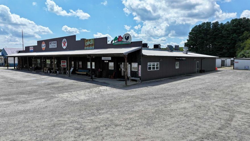 Prime commercial property for sale: 13,360 sq. ft. turnkey complex featuring Pap’s Place, Farmhouse Café & Boutique, and Saf-Stor Mini Storage. Pap’s Place – 10,000 sq. ft. open-plan space with durable red iron metal construction, dedicated office, and attic storage (25’x75’). Ideal for retail, events, auctions, or future expansion. Farmhouse Café & Boutique – 3,360 sq. ft. fully equipped and operational, with two fire-code-approved kitchens, 8’x12’ walk-in freezer (2 yrs old), two walk-in coolers (largest 8’x14’), vent-a-hoods, 3-bay sinks, prep/storage areas, buffet, tables/chairs, washer/dryer, and four 5-ton HVAC units under warranty. Features two dining rooms, banquet/party room, office, four restrooms (one with shower), upstairs storage (25’x100’), man cave/security room. Boutique offers showroom, 2 dressing rooms, 2 baths, separate A/C, and adjacent woodworking area. Entire property: foam-insulated for efficiency, plus 28-camera surveillance system (interior/exterior with audio at register), monitored via phone/office. Saf-Stor Mini Storage provides steady income with 77 units: 40 (10x10) @ $40/mo, 31 (10x15) @ $60/mo, 6 (5x15) @ $30/mo, plus 10x20 @ $70/mo.