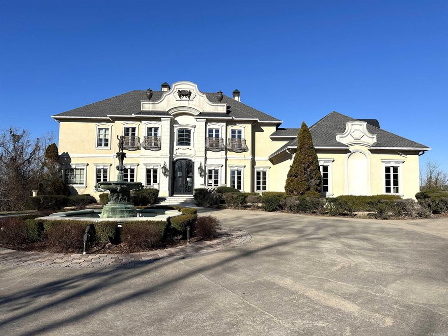 Welcome to 12 Liveree Ln. A stunning 3 story home with mountain views and a private gated entrance. This home offers 4 bedrooms each with their own private en-suite and walk in closets. The kitchen has a hearth room with a gas fireplace, and a door leading to the balcony. Other rooms throughout the home include a 2 separate laundry rooms, a library, office, large downstairs living area with a fireplace, an indoor lap pool, Sauna, safe room, elevator, and storage and bonus rooms galore. There is a custom in-ground pool and 3 car garage all situated on 5 beautiful acres. This one is a must see! AGENTS SEE REMARKS