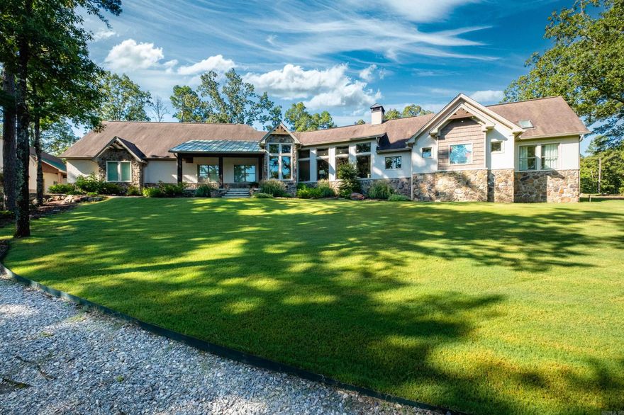 This exceptional equestrian property in Roland (bordering Ferndale) boasts an array of custom-built amenities designed for comfort, utility, and luxury. Key highlights include a 36'x48' custom equestrian barn with four 12'x12' stalls, individual run-outs, indoor wash bay, and cedar-lined tack room with mini split HVAC—all complemented by a fenced 4+ acre pasture with riding arena, paddocks, and loafing sheds. Additional improvements include a 30'x40' foam-insulated shop with mini-split HVAC, a detached 2-car garage with a 662± sq ft upstairs efficiency apartment (both have own mini-split HVAC), and multiple equipment/trailer sheds and storage The main house is designed with rustic elegance and features 4 bdrms, 3 baths, gourmet kitchen, wet bar, a safe room/wine cellar, climate-controlled dog room with a bathing station, and scenic views of a stocked pond w/ fountain and the equestrian facility. Outdoor spaces are enhanced with irrigation, solar lighting, and extensive fencing using 4-rail corral board. Numerous items convey, including an automatic generator, hot tub, three refrigerators, AV equipment, and more, adding turnkey value to this remarkable property!