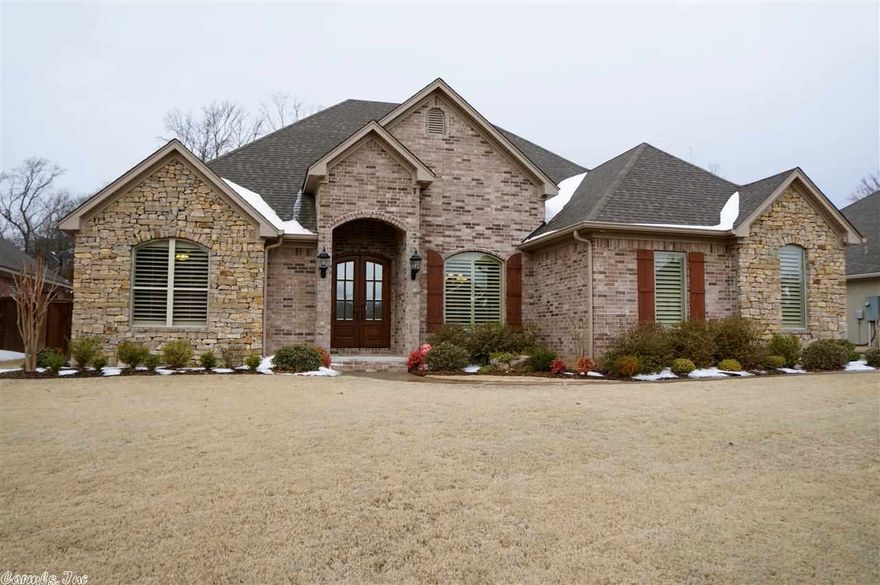 Beautiful Home on Large level lot.  Backs up to woods.  Open floor plan.  Kitchen has an island and granite counter tops.  Stove has a 5 burner gas range and hickory cabinets.  The hearth room has a custom made fireplace.   House features a formal living and dining room.  The master bedroom is huge and the master bath has a whirlpool tub and a separate shower.  Master closet is big with built-ins.