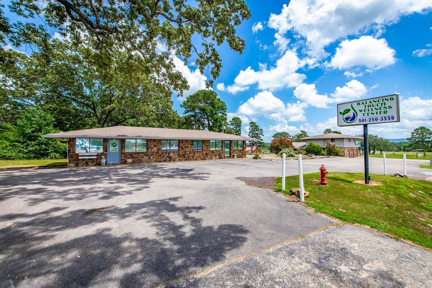 This is a great opportunity for a Business right in the "heart of Greers Ferry". This land already has an existing building with a business leasing it. The land has room for several types of businesses.  At one time there was a working Carwash located on the property so there is plenty of space for another one, or in the back of the land even a small RV Storage or even several Food Trucks to keep the vacationers able to have a variety of small restaurants.  Lot of options and many opportunities await.  Take a tour and get started on your new business today. ( The two story Chiropractic Clinic is not included in this sale. )