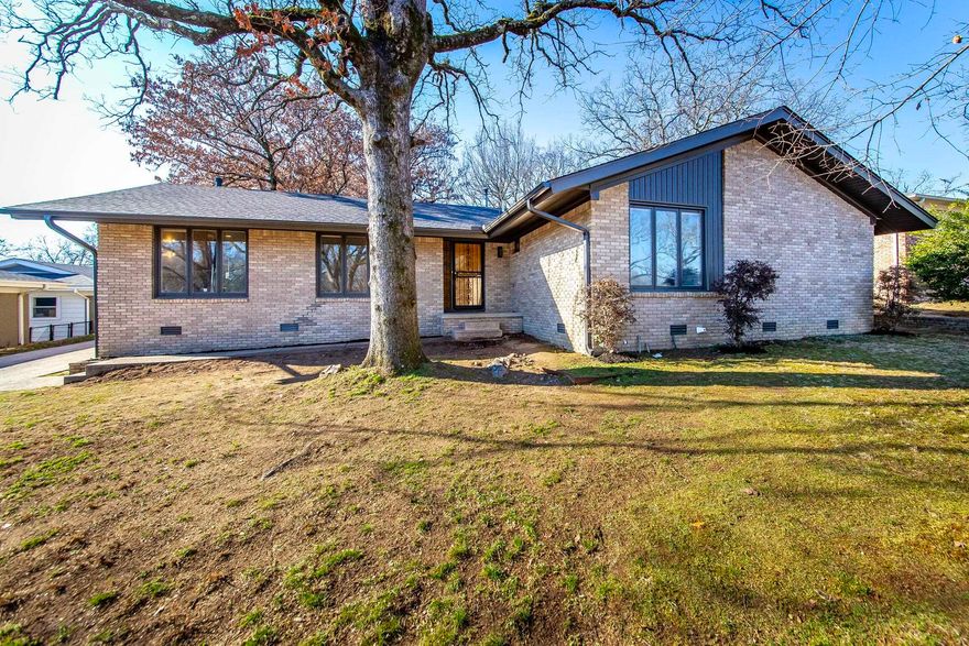 Welcome to 5205 N. Vine St., North Little Rock, a stunning blend of modern updates and mid-century charm. This redesigned 4-bedroom, 2-bath ranch sits on a generous 0.40-acre lot, making it one of the largest in the neighborhood. The fresh exterior creates instant curb appeal, while the rear-entry carport ensures privacy and convenience. Step inside to discover refinished hardwood floors and a stylishly updated interior. The kitchen is a showstopper, featuring brand-new stainless steel appliances, a four-seat island, and modern light fixtures. The bathrooms have been artfully transformed, with the main bath offering a soothing palette and the owner’s suite showcasing bold, mid-century-inspired designs. Outside, enjoy a spacious yard perfect for entertaining, a dog run, and a storage shed for all your needs. This home offers the ideal mix of style, comfort, and practicality. Schedule your private showing today!