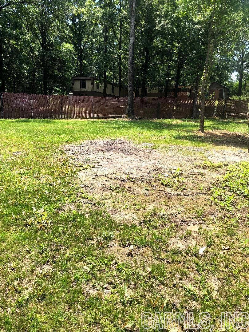 LARGE FENCED LEVEL CORNER LOT IN PERRYVILLE CLOSE TO HARRIS BRAKE LAKE !!! This property is with in walking distance to Harris Brake Lake. Has all the utilities already available on this property and is ready to go for your new home, modular home or camper/RV. Surrounded by Harris Brake Lake all around this property which would make for fun times and memories made with family and friends for great fishing, picnicking, swimming and boating for fun in the sun. Boat ramps are close by for easy accessing your boat. This property has "NO RESTRICTIONS"