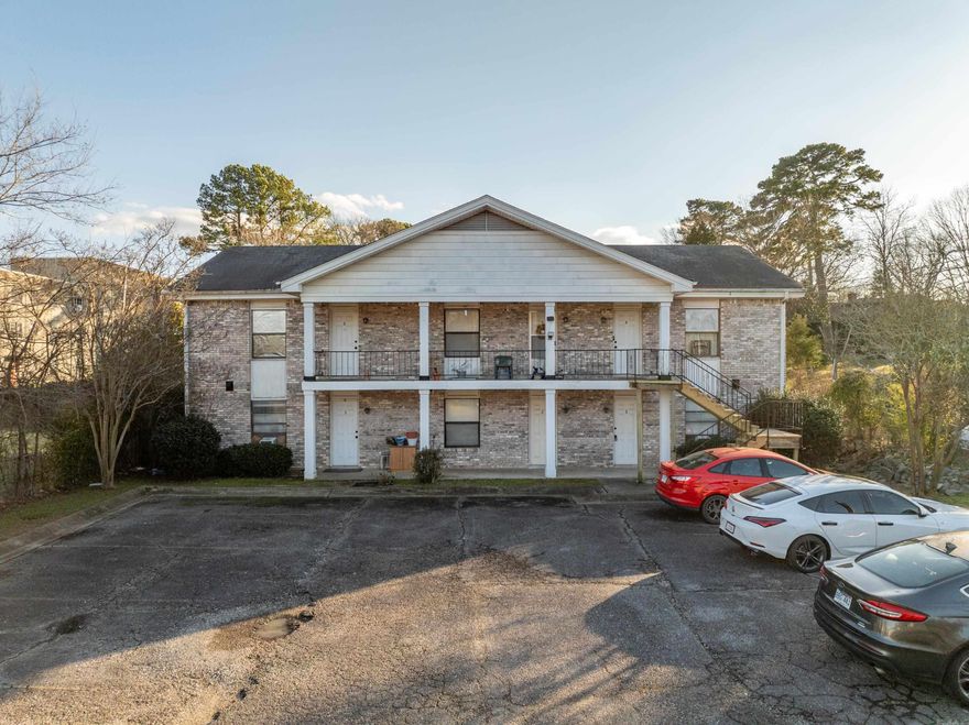 This is a wonderful rental complex--It is Fully occupied and 1 resident has been there 12 yrs!  It's very close to Bus Routes, Downtown Hot Springs and the Bypass. Owners provide water/trash and lawn service and tenants provide everything else... Out of state owners are going in a different direction and have decided to sell. RENT ROLL AVAILABLE TO QUALIFIED BUYERS!  Fully occupied, 3 upstairs and 3 downstairs units...All are 1 Br 1 Bth--Many renovations have been done, including paint, flooring, several appliances and several HVAC systems--New Iron and Wood stairs to the top 3 units were built in 2024. All units are Central Heat and Air.  Each unit has 2 Entrances, 1 on the parking lot side and 1 on the Manor Cir side. ALL 9' CEILINGS.. Very Nice Tenants in place that always pay on time and cause no issues!    24 HR NOTICE FOR ALL SHOWINGS