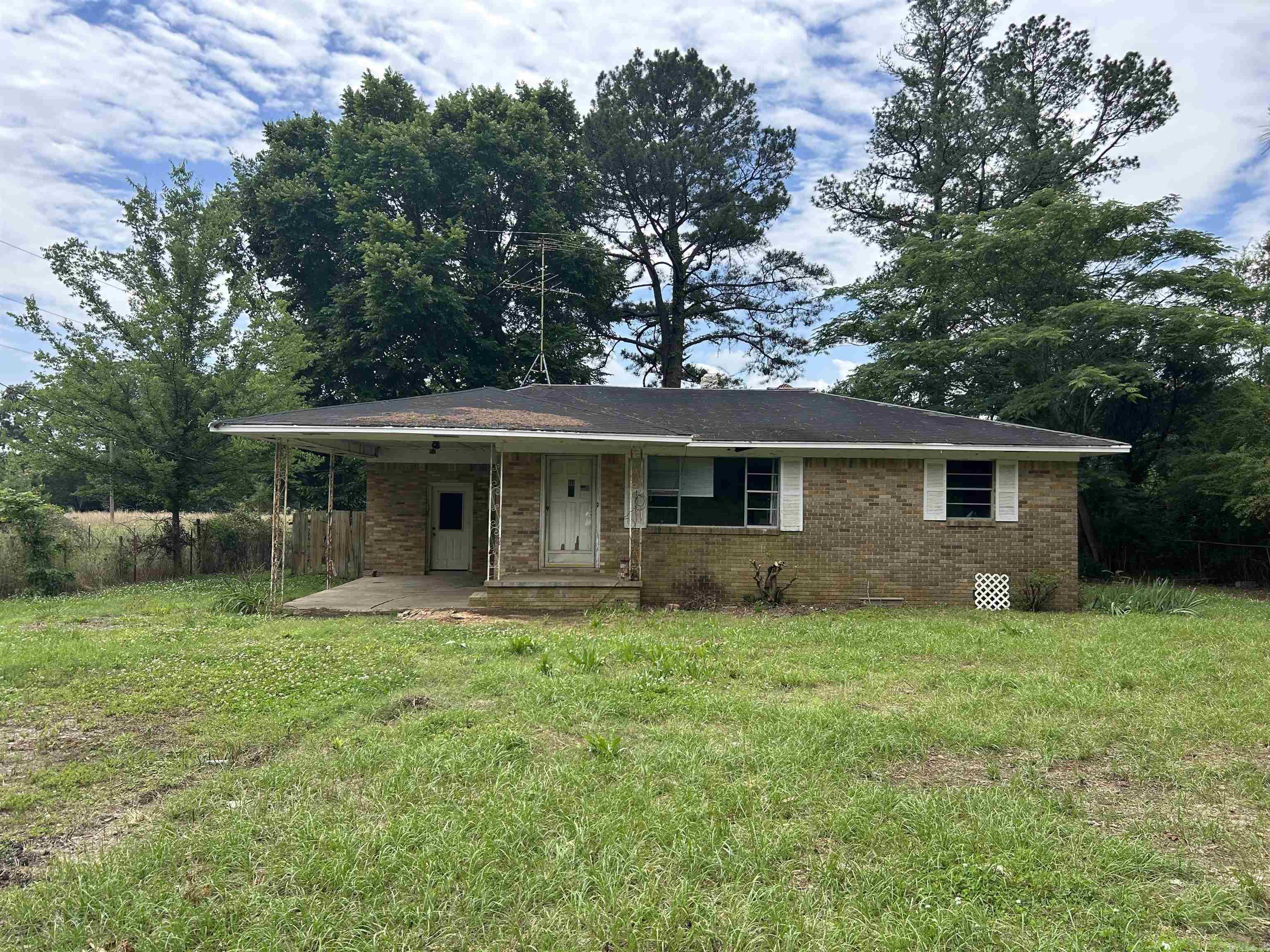 Unlock the full potential of this 2-bedroom, 1-bath home sitting on a spacious 1-acre lot! This home is in need of some remodeling, offering a blank canvas to customize to your taste or for resale. Featuring a large kitchen and living area, this home provides ample space for an open-concept design. The property includes a single-car carport and a partially fenced backyard, with the back half of the lot fully enclosed – perfect for pets, gardening, or future development. Whether you’re an investor, flipper, or someone looking for a project with great potential, this is an opportunity you don’t want to miss. Schedule a showing today and imagine the possibilities!