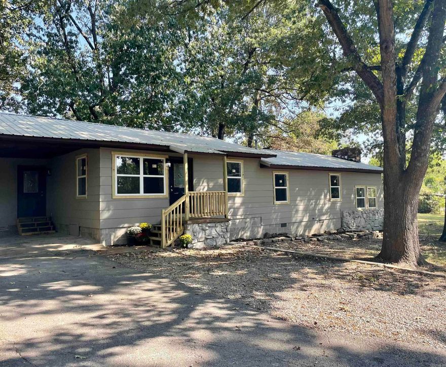 This beautifully remodeled home has 1674 sqft+/- of living space with 3 ample sized bedrooms and 2 full baths in a split-level floor plan.  The main living area is adorned with beautiful hardwood floors and provides an unobstructed view of the dining area and kitchen.  The masterfully remodeled kitchen features stylish new cabinetry, and the butcher block counter tops add to the aesthetic. Just off the main living area you will find a quaint home office space. The first of the full baths is easily accessed from the main living area.  All 3 bedrooms are situated on the split level.  All feature new carpet and plenty of closet space. The second full bath shares this level, as well as the large laundry room.  Finally, the sunken second living area provides extra space for entertaining and features a rock fireplace that is plumbed for a gas insert.  Just off the kitchen and dining area through the French doors you will find a large wood deck perfect for outdoor entertaining.  This home has been updated with new windows, electric, plumbing and new HVAC.  All of this sits on a quiet dead end road in the heart of Pocahontas.