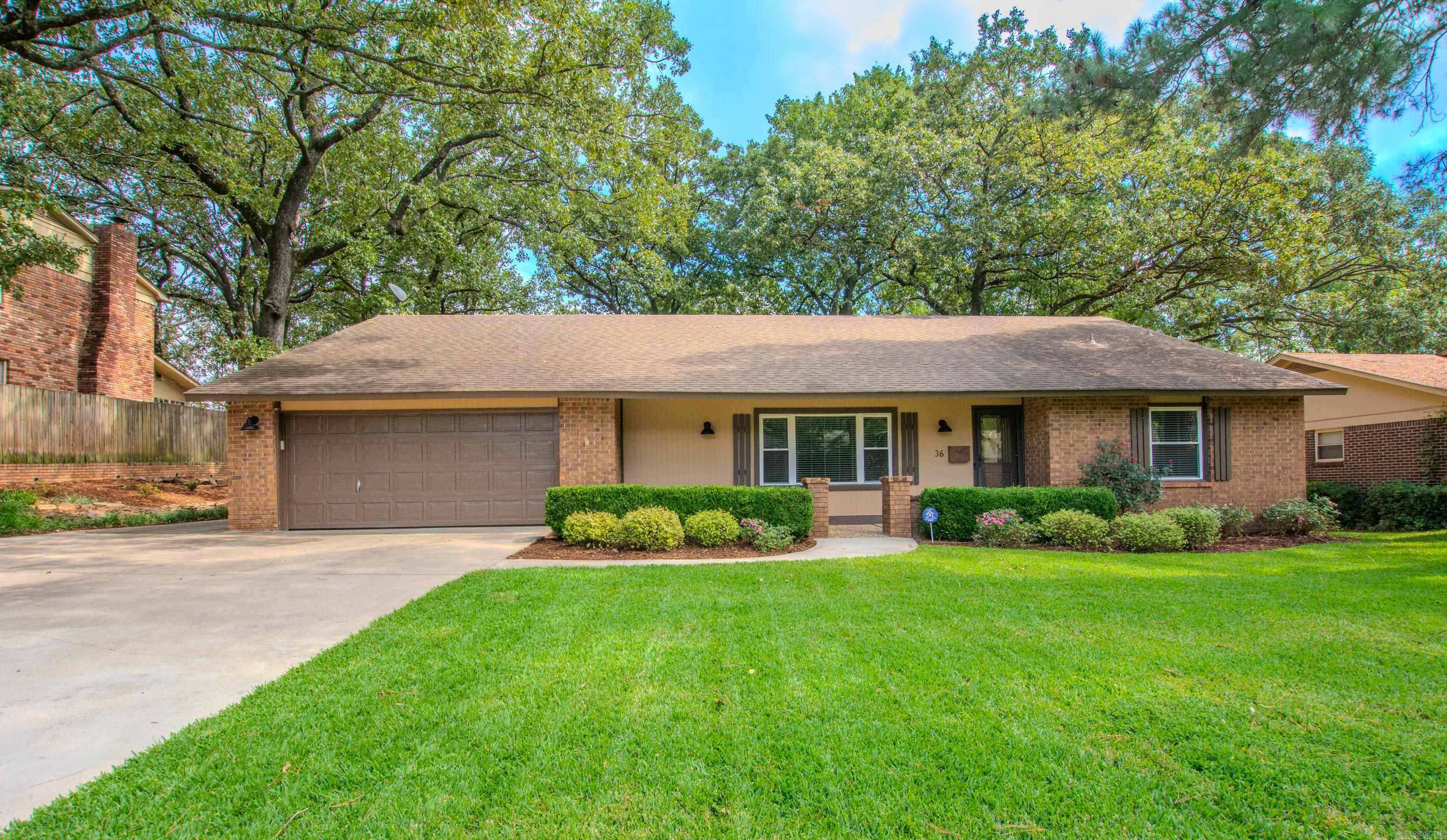 Spacious and beautifully updated, this 4-bedroom, 3-bath home sits on a large lot with a fully fenced backyard—perfect for privacy, pets, or play. The modern kitchen features updated cabinetry, countertops, and appliances, including a refrigerator and brand-new microwave that can stay with the home. Bathrooms have also been tastefully updated, offering a fresh, move-in-ready feel. The primary suite is a true retreat with a sunroom, jetted tub, and step-in shower, plus a huge closet. Additional bedrooms also feature generous closet space. Gather around the cozy gas fireplace in the living room, or enjoy outdoor living with plenty of yard space. One year VIP Package with Guard Home Warranty provided. Agents see remarks Practical features include a two-car garage, abundant storage, and modern conveniences. With its thoughtful updates and inviting layout, this home is ready for its next owner to love.