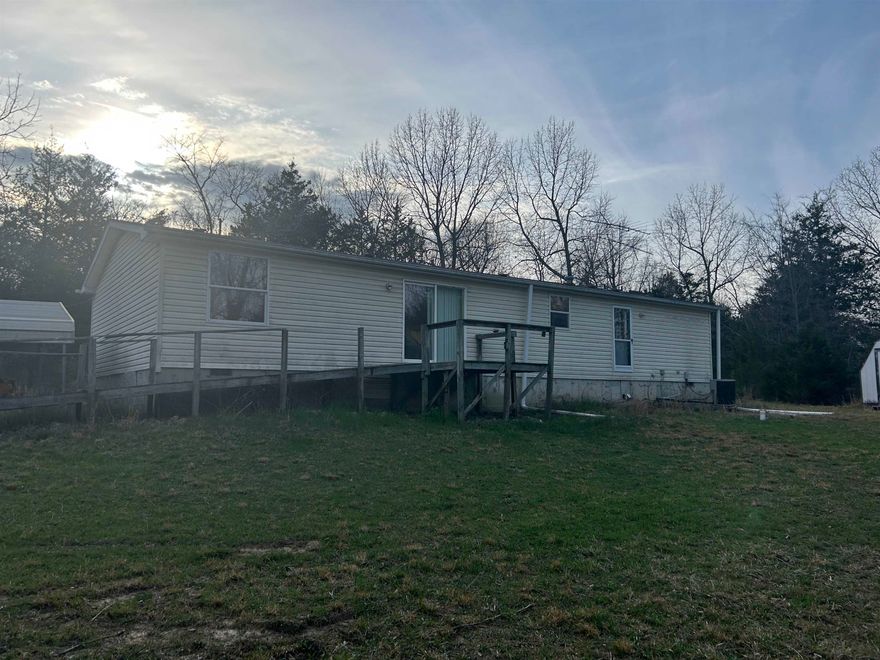 4-bed, 2 full bath 2002 mobile home plus 16 acres m/l.