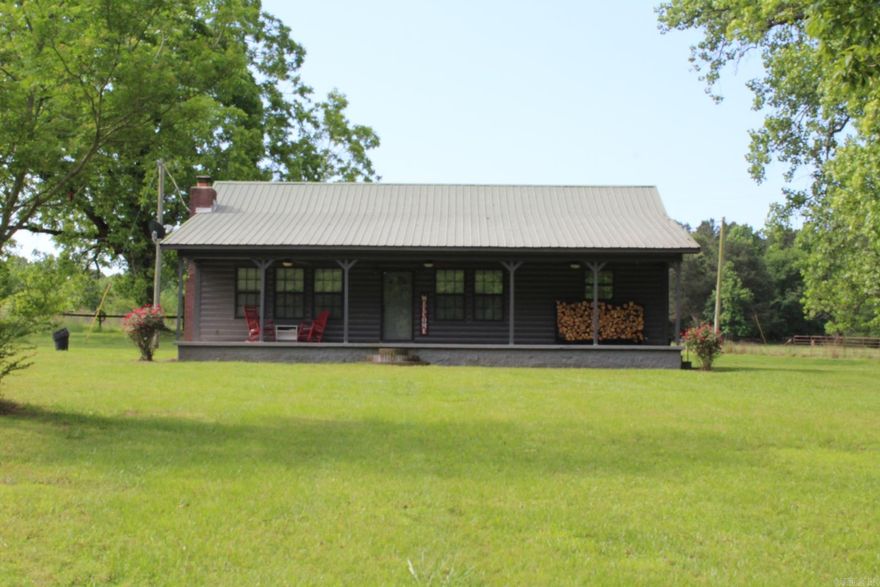 MOVE IN READY - FULLY FURNISHED 1 bed, 2 full baths Log Home with approx. 1400 Sq. Ft. of living space situated on approx. 12.93 acres with a rural secluded setting.  Family area features a large brick wood burning fireplace, beamed ceiling. Bath features a Jacuzzi tub.  Central A/C & Heat.  Property has a 24 x 24 shed with 220 volt wiring and a pond.