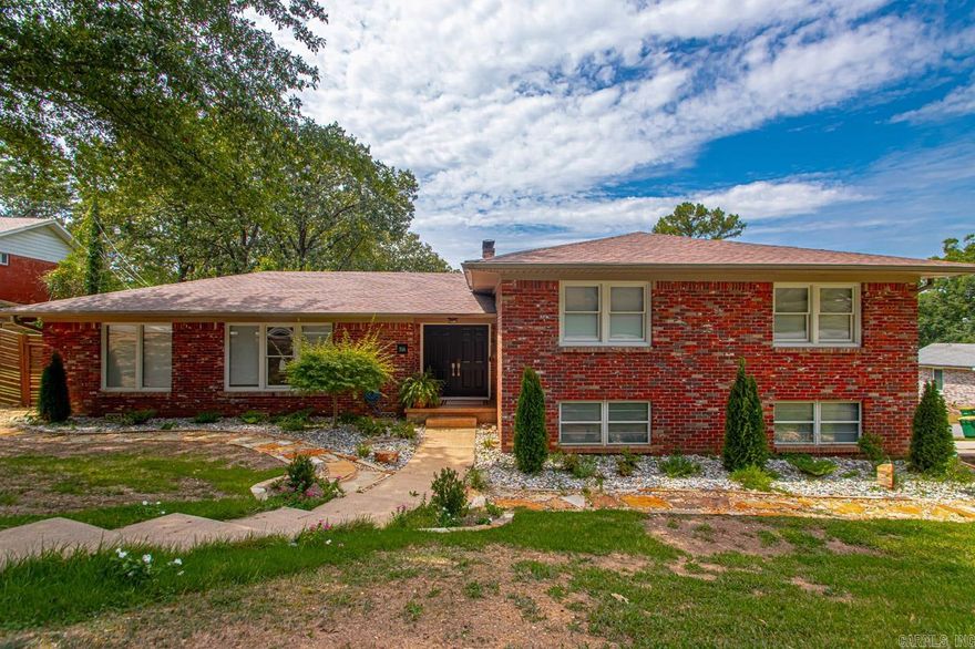 Beautifully maintained home nestled in the desirable Midtown neighborhood.  This 5-bedroom, 3-bathroom property sitting on a corner lot offers a perfect blend of comfort, convenience, and character. With over 2800 sq. ft. of living space, this home is ideal for both relaxation and entertainment. As you step inside, you’ll be greeted by a spacious living room bathed in natural light, featuring a cozy fireplace and hardwood floors that add warmth to the space. The updated kitchen has modern appliances, farmhouse sink, ample counter space, and a breakfast nook, perfect for enjoying your morning coffee. Four bedrooms upstairs including the primary with en-suite bath. The additional bedrooms are generously sized, providing flexibility for a home office and guest space. The private backyard has a great deck ideal for hosting summer BBQs or simply enjoying a nice evening outdoors. Located in a quiet, family-friendly neighborhood, this home is just minutes away from local schools, shopping centers, and dining options, as well as easy access to downtown or west Little Rock.