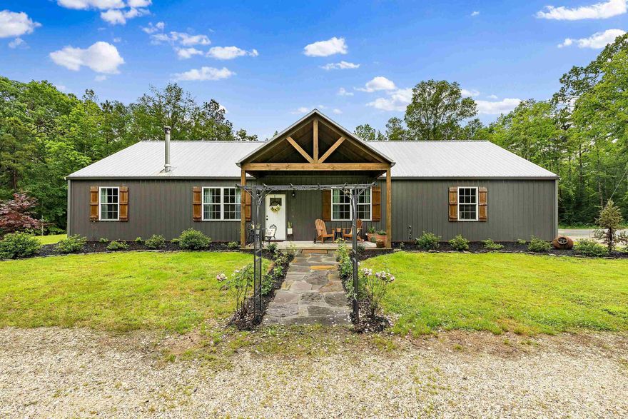YOU DON'T WANT TO MISS THIS ONE!! Welcome to your dream barndominium retreat nestled on 8 secluded and private acres of scenic countryside. This custom-built home blends rustic charm with modern amenities and energy efficiency. Inside, you'll find spacious open-concept living with spray foam insulation for year-round comfort, tons of pull outs in kitchen cabinets, a walk-in pantry perfect for storage and prep, and a secure safe room for added peace of mind. High speed fiber optic internet ensure seamless connectivity for work or entertainment.  Speaking of entertainment, step outside and enjoy your own backyard oasis with a beautiful IN-GROUND POOL, cozy fire pits for evening gatherings, hot tub, and an 8x10 storage shed. All of this just 5 mins away from Brushy Creek boat ramp!!!!
