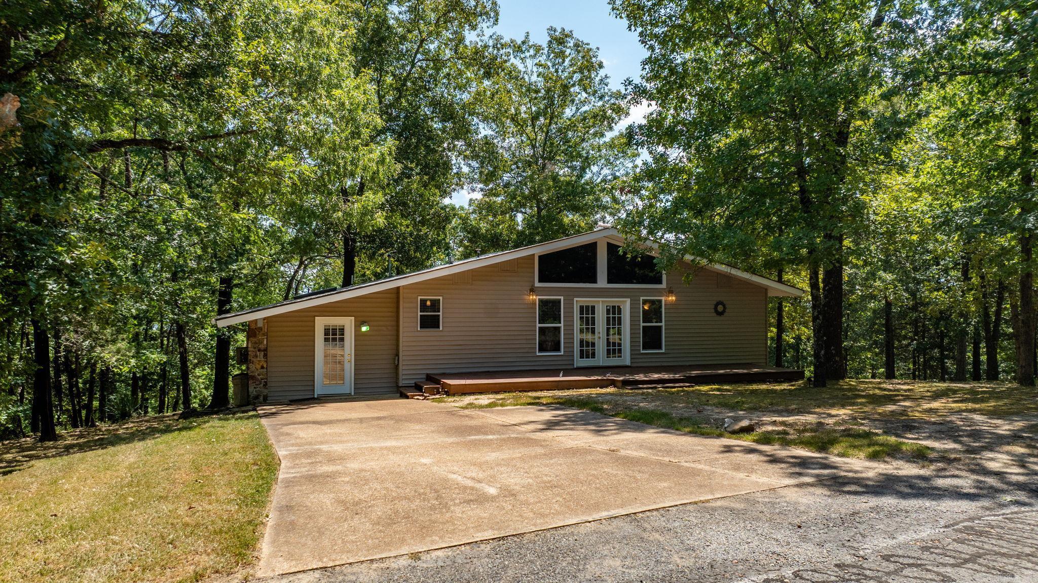 Welcome to this beautiful 3-bedroom, 2.5-bath home offering seasonal lake views and a spacious, inviting layout. From the moment you step inside, youāll be greeted by soaring vaulted ceilings and a cozy fireplace that creates a warm and welcoming atmosphere. The open floor plan provides plenty of space for entertaining, while large windows bring in natural light and frame the serene surroundings. The kitchen and dining area flow seamlessly for easy gatherings, and the generous bedrooms provide comfort and privacy for family or guests. The primary suite features its own bath retreat, making it the perfect place to unwind. Step outside and enjoy the outdoors from both the front and back decks ā ideal for morning coffee, evening relaxation, or hosting friends while taking in the peaceful setting. Whether as a full-time residence or a weekend getaway, this home combines comfort, charm, and scenic views in a wonderful location.