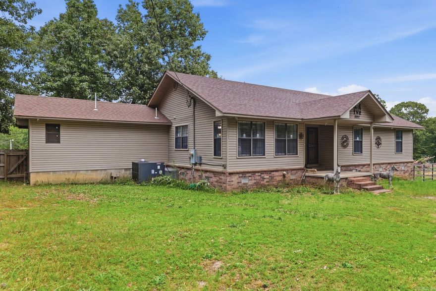 Spacious country living with room for both you and your animals! This 3 bedroom, 2 bath home sits on approximately 3.51 beautiful acres and offers a unique blend of comfort and functionality. Inside, you’ll find a dedicated dog room complete with a raised bathtub for easy pet grooming. The large back deck is perfect for relaxing or entertaining while enjoying the peaceful surroundings. Horse lovers will appreciate the small riding arena and barn with stall walls already in place, ready for finishing touches. Additional features include a security system with cameras for added peace of mind. Washer, dryer, and refrigerator all convey with acceptable offer. Enjoy the space, privacy, and endless possibilities this property has to offer!