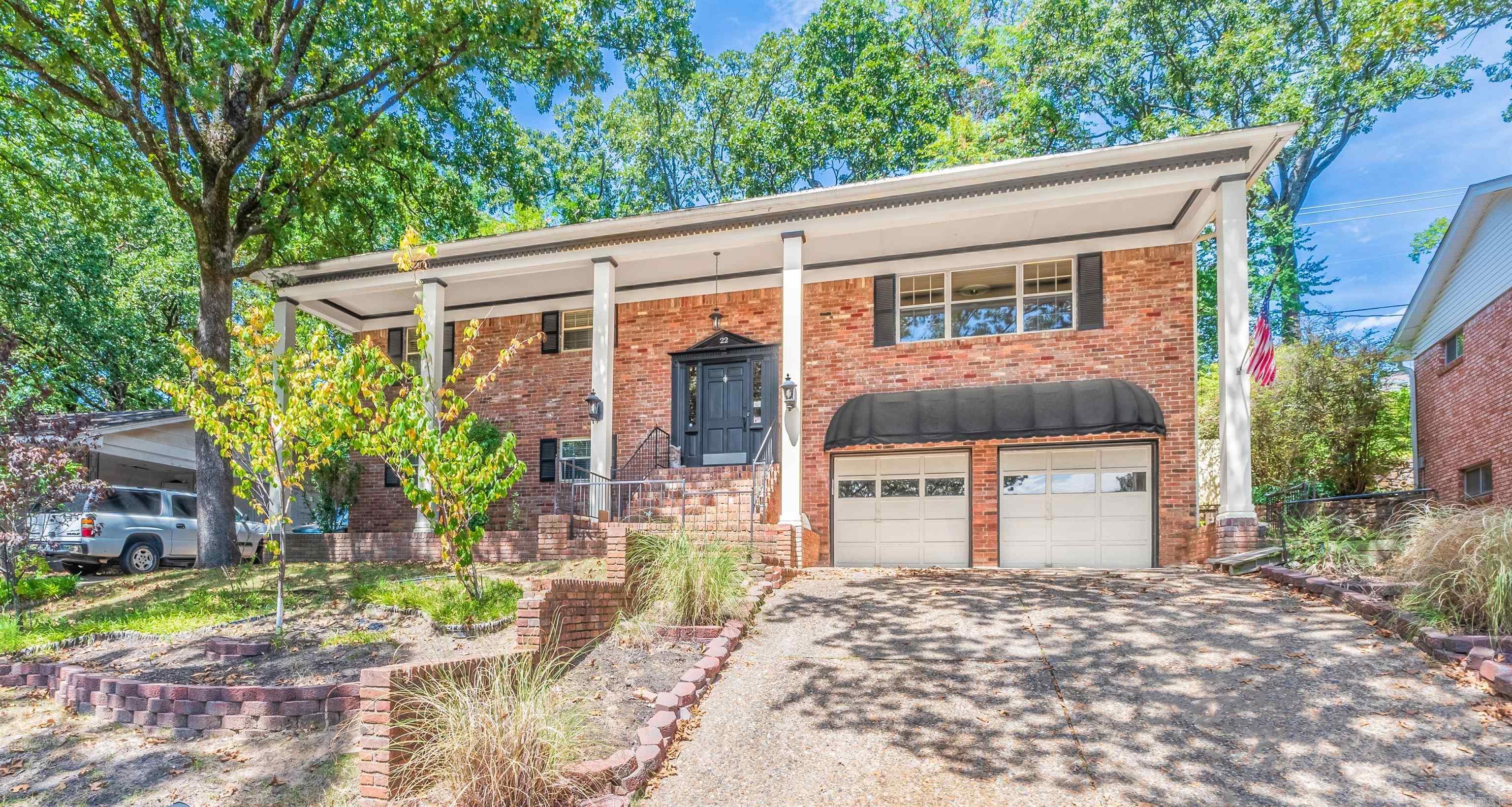 An absolute GEM in the heart of the city ! Great curb appeal sitting high above others, welcoming front porch leads into large foyer then split level with spacious family room, huge windows with great natural lighting. Dining room and eat in kitchen with breakfast bar. Primary suite has lots of room and second bedroom up as well. Downstairs three bedrooms and laundry room can be used for so many things. Big fenced in backyard with seclusion, two car garage and outdoor storage building. Come see it and fall in love ! *Agents see confidential remarks*