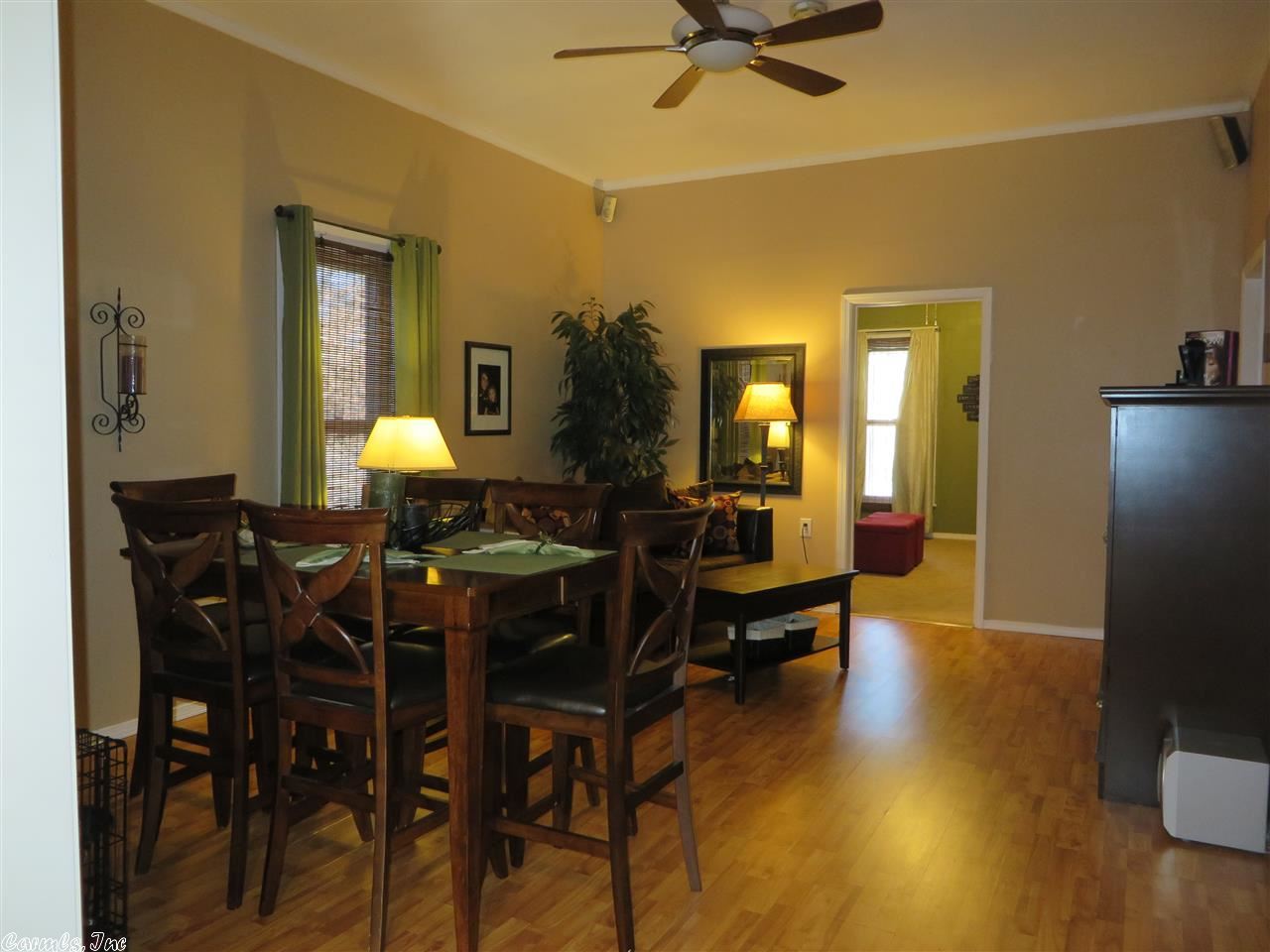 Trendy meets vintage charm with 12 ft ceilings & very spacious rooms. Energy efficient. Updated colors. All appliances to convey includes refrigerator, washer, dryer, stove, dishwasher. Also included in the wired in surround sound. Must see! Corner lot. Outside storage.
