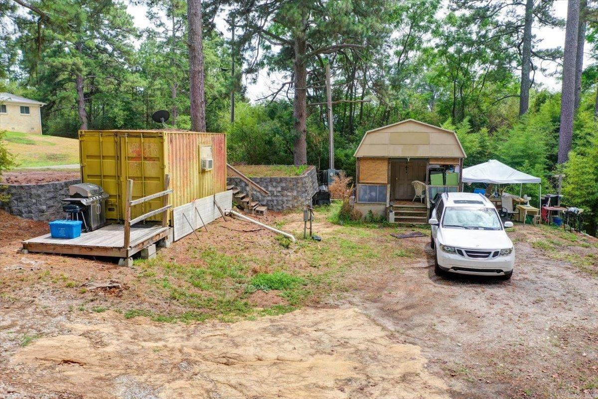 Prime Corner Lot with Unique Living Spaces and Exciting Potential Welcome to your next venture in versatile living! This corner lot offers an array of possibilities, from embracing the charm of Tiny House living to constructing your dream home. Situated conveniently in a central location near major amenities, this property boasts numerous improvements and utilities, making it an ideal canvas for your vision.