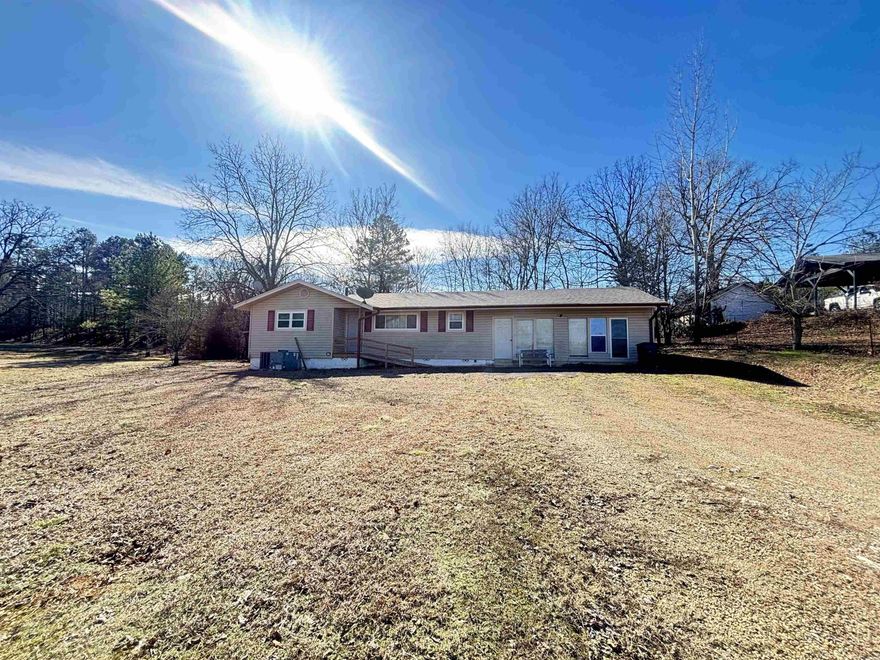 Just minutes from Lake Ouachita, this 3 bedroom, 2.5 bath older home would make the perfect investment for a renovation project or vacation rental. Features a den or dining area with pantry and another bonus room that would be a great game or craft room! New roof was installed in 2023 and wheelchair ramp added to the front entrance. With a little TLC and creativity, this property has loads of potential! Don't miss this opportunity! Potential purchasers please be aware that house is being sold as-is with no repairs. AGENTS SEE REMARKS.