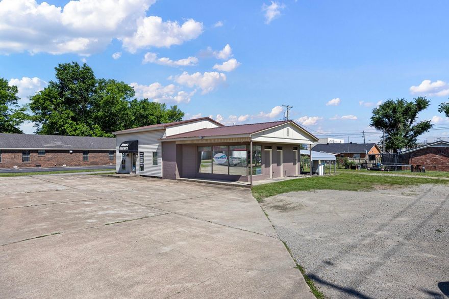 Commercial building located on Main Street in Clarksville offering excellent visibility and accessibility. Interior features include a kitchen area, bathroom, and shower, providing flexibility for a variety of business uses. Hot water tank was replaced in 2025. Roof replaced in 2020. Exterior was freshly painted in 2025.  Property also includes an exterior bathroom and an additional detached room that was previously a bathroom and could be converted back. Functional layout with multiple-use potential, ideal for retail, office, or service-based businesses.