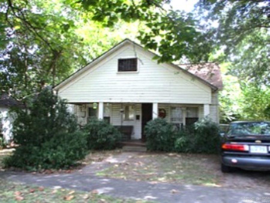 This Strategic Investment property lies within the City of Mena's current plans for tourism expansion, and should be explored immediately. While the house sitting on this residential lot is not livable as it is, it's footprint could offer a new rebuilding opportunity. The location beckons something wonderful considering it is happily situated directly across from the fountained pond at Janssen Park. The Park offers picnic areas, serene ponds with a foot bridge, state of the art playground equipment, restroom facilities, historical points of interest, and walking paths. It also carries significance as the primary location for year round festivals and events for the community. In working with the City Code Enforcement, the possibilities could be very rewarding. Selling AS IS. Agents please read showing remarks and agent remarks.