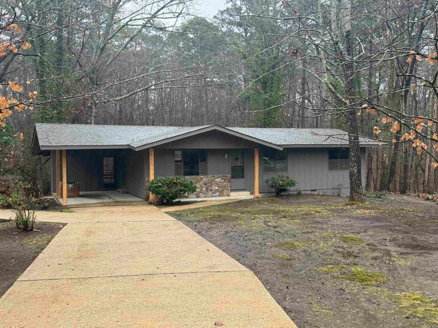 UPDATED one level 3 bed 1.5 bath with nice covered porch and long driveway. NEW roof, heat & air, flooring, paint in & out, LED lights, cabinets, granite counters, etc. Single carport with extra storage. Super cute & ready to move in. Kitchen has breakfast bar opening to living room. All electric. Nice trees. Hot Springs Village is a large private gated community with all kinds of amenities:  clubhouse, golf courses, tennis, pickleball, swimming pool, lakes, marina, restaurants, walking trails, farmer's market, etc. Possible 100% RD financing. SEE AGENT REMARKS FOR OFFER SUBMISSION INFO.