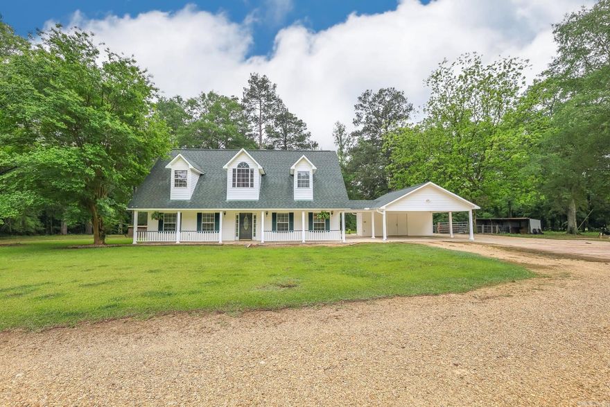 Country living in one of the area's favorite just-south-of-town locations!  Offering 4+ acres of picturesque land, this charming farmhouse provides the perfect balance of space and privacy, with plenty of room for gardening, outdoor activities, or even small livestock.  The exterior is designed for easy care, allowing you to spend more time enjoying the beauty of the property and less time on maintenance. New roof installed in 2020.  Inside, you'll find a welcoming ambiance with a beautiful fireplace, perfect for warming up on cooler evenings. The airy feel creates a sense of flow and natural light, making it an inviting space to entertain or relax.  This farmhouse is ideal for those seeking the bliss of a serene country lifestyle with the convenience of modern comforts and access to local amenities. Don’t miss the opportunity to make this rural retreat your own!