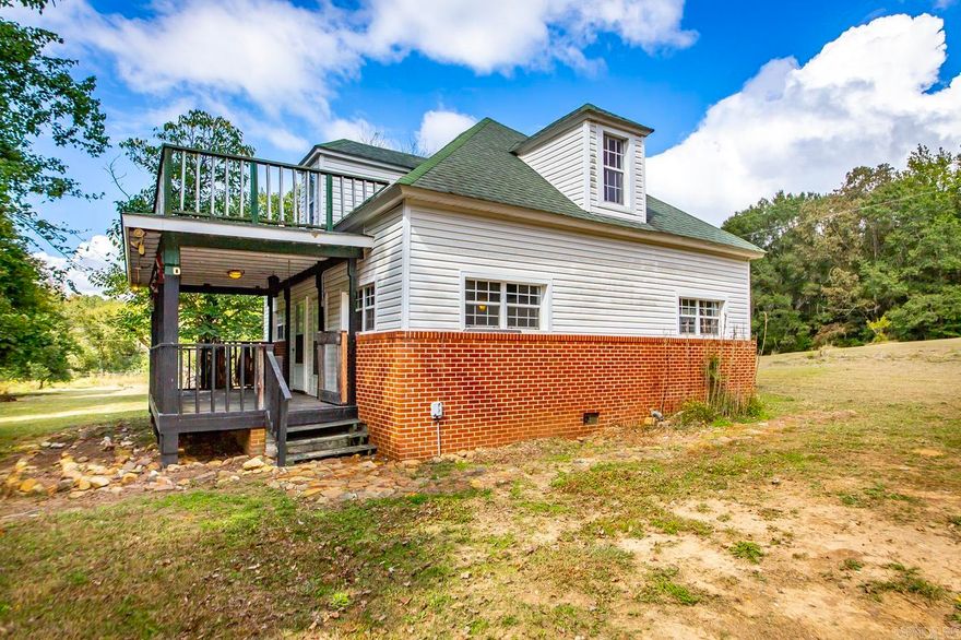 Located in the country near Mena, this home sits on 10 acres of partially wooded land, providing added privacy and open space. The property offers flexibility for buyers, who can purchase all 10 acres, split the acreage, or choose a combination of land and home. Light-filled, open living areas offer functional space, and versatile rooms can be adapted to fit your needs. The yard provides room for outdoor activities, gardening, or additional structures. With its convenient location, country setting, and flexible acreage options, this property presents a rare opportunity for those seeking space and privacy.