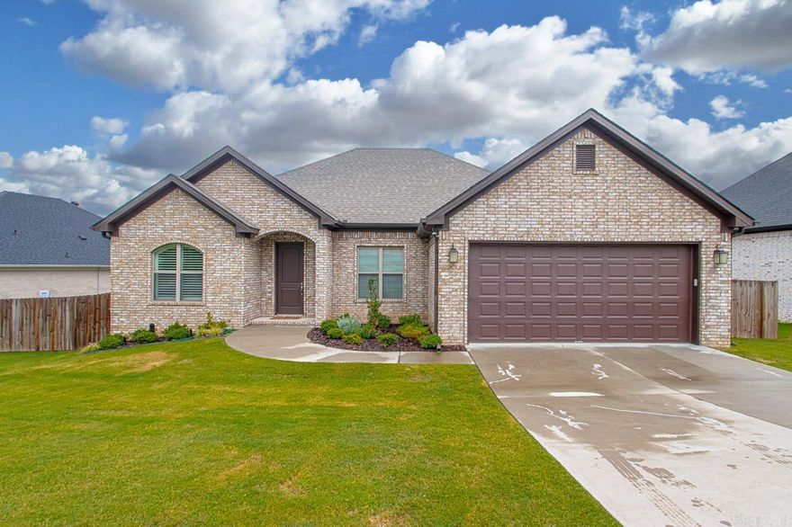 PRICE IMPROVEMENT!!! This 2312 sf home was completed in December of 2021 and occupied less than 3 years; it has been meticulously maintained!  Very inviting with neutral finishes, an open concept living space; living room is very spacious and includes a formal dining area. Wood flooring and ceramic tile! Modern Kitchen with stainless steel appliances, beautiful cabinetry with granite countertops and eat in area.  Large primary suite features a bathroom with jetted tub, separate custom shower and expansive closet connecting to the laundry room.  Outside you will find a fully fenced yard with 10'X12' storage building and covered patio. 2 car garage with built in workbench and custom applied epoxy flake coating covers the concrete slab.  Tankless gas water heater! Show it today!