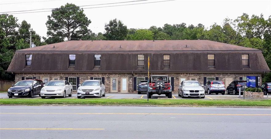 Excellent Location with Great Access and Visibility.  This Unique Income Producing Property is Fully Occupied with 7,980 sf; the First Floor has 4,200 sf of Office Space  and the Second Floor has an 1,800 sf Office and 4 Residential Apartments with 1,980 sf.  Convenient to Local Shopping, Restaurants and other businesses.  This Area Continues to Revitalize and Offers a Great Investment Opportunity.    Priced Aggressively Below Appraised Value.  Call or Email For More Information.