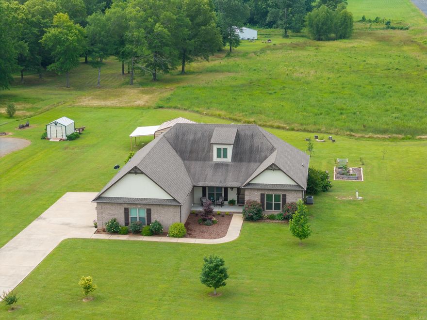 Just in time for summer! Move in and enjoy this meticulously kept home on 3.26 ACRES! The backyard features a beautiful garden and firepit, PLUS easy-to-catch largemouth bass in the neighborhood fishing pond. Inside, relax and unwind beside the fireplace or host a movie night in the upstairs BONUS ROOM, which could easily serve as a 4th BEDROOM. The three oversized bedrooms on the main floor, including the primary ensuite, are each spacious enough for a private sitting room or office. Both full bathrooms feature dual sinks and walk-in showers. Entertaining is effortless with an open floor plan featuring a generous dining room area, large kitchen island, coffee bar, walk-in pantry, and half bath for guests. The main floor laundry room and back entrance built-ins make everyday tasks a breeze. Additional storage can be found in the attic and the 25x25 two-car garage which contains an underground storm shelter as well. The 19x20 shed and adjacent lean-to are the perfect place to store your boat, ATVs, and other toys. This home is a FANTASTIC VALUE you won't want to miss in the growing community of Greenbrier, AR which features A-rated schools! Association dues are paid through 12/2026!