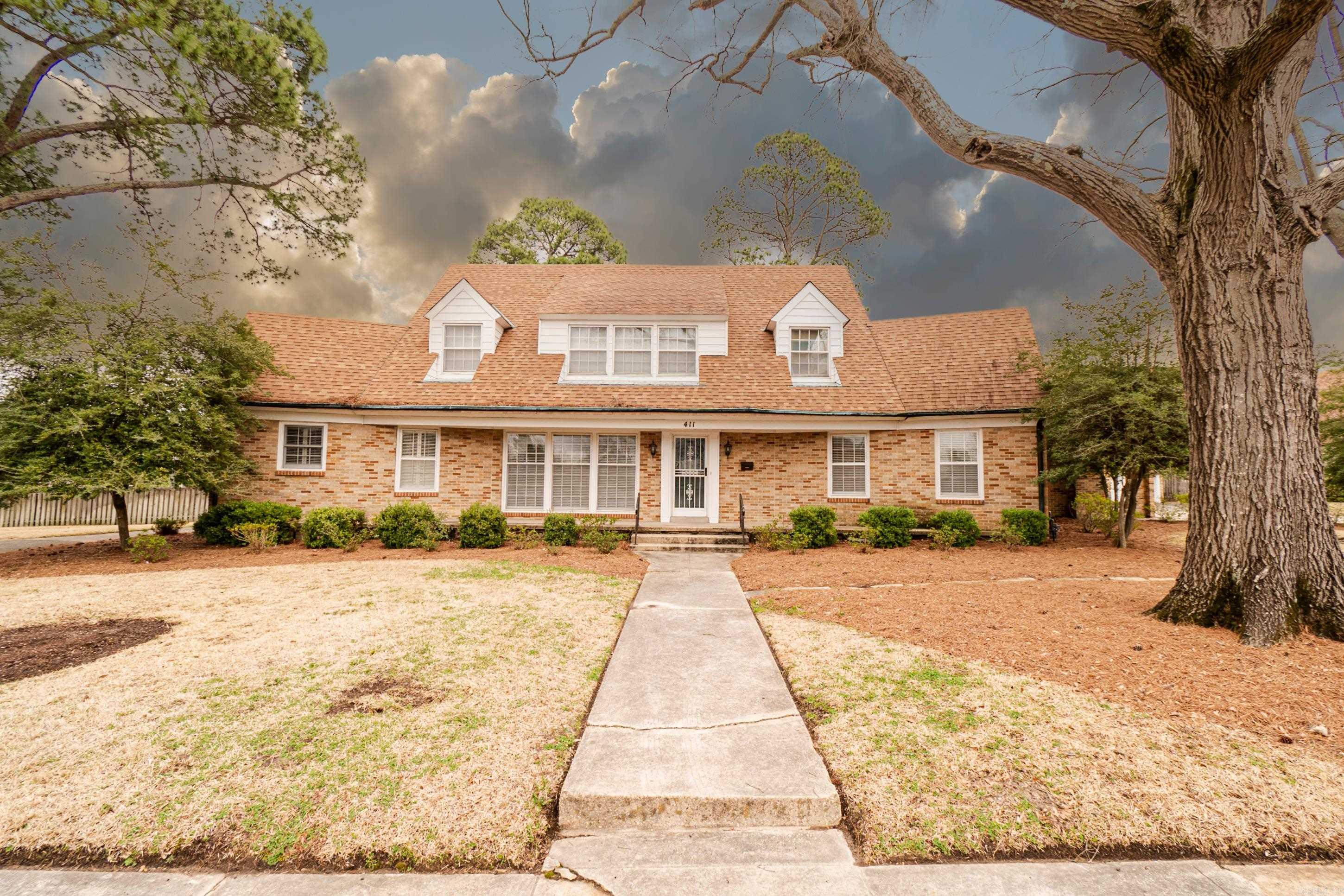 This beautifully renovated 4-bedroom, 2.5-bath home sits on nearly an acre, offering plenty of space both inside and out! Freshly updated with new paint and flooring downstairs, this property is move-in ready. The den features stunning walnut tongue-and-groove walls, adding warmth and character to the home. With ample parking and a convenient storage building, this property is ideal for a large family or a business looking for room to grow. Previously home to the Eagle Foundation, the possibilities here are endless!