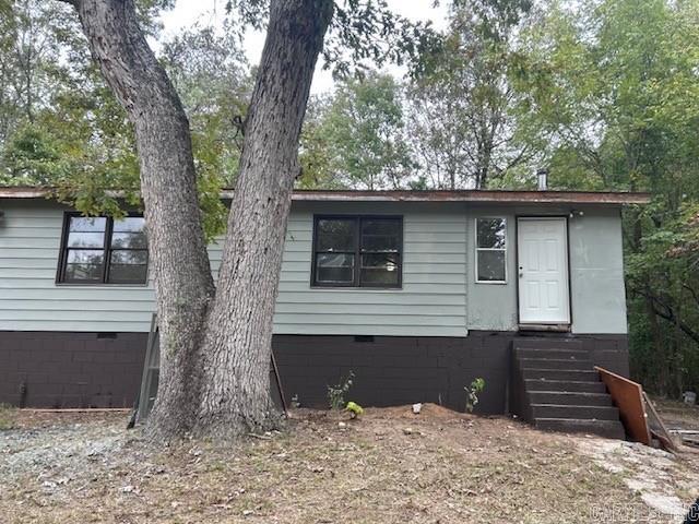 Remodel opportunity: Charming 3-bedroom, 2-bath ranch-style home in the heart of Cherokee Village. With 1,440 sq. ft. of living space, this single-level home sits on a shaded lot of nearly a quarter acre. The Home overlooks a spacious yard with plenty of trees, offering a quiet setting with plenty of privacy. Conveniently located near lakes, golf courses, and all the amenities of Cherokee Village. The property will need to be finished out with flooring and other improvement's. Property is being sold as-is.