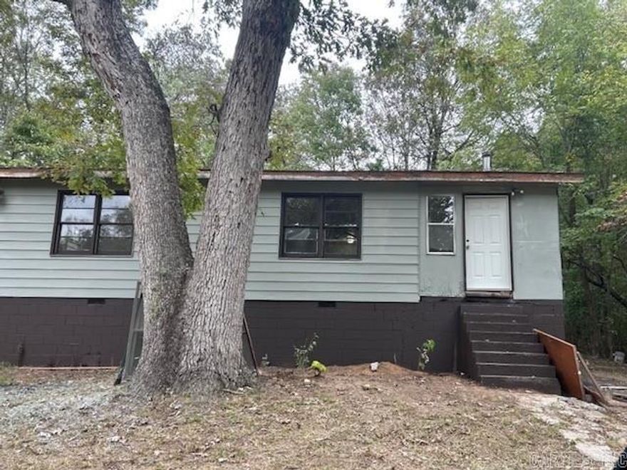 Remodel opportunity: Charming 3-bedroom, 2-bath ranch-style home in the heart of Cherokee Village. With 1,440 sq. ft. of living space, this single-level home sits on a shaded lot of nearly a quarter acre. The Home overlooks a spacious yard with plenty of trees, offering a quiet setting with plenty of privacy. Conveniently located near lakes, golf courses, and all the amenities of Cherokee Village. The property  will need to be finished out with flooring and other improvement's. Property is being sold as-is.