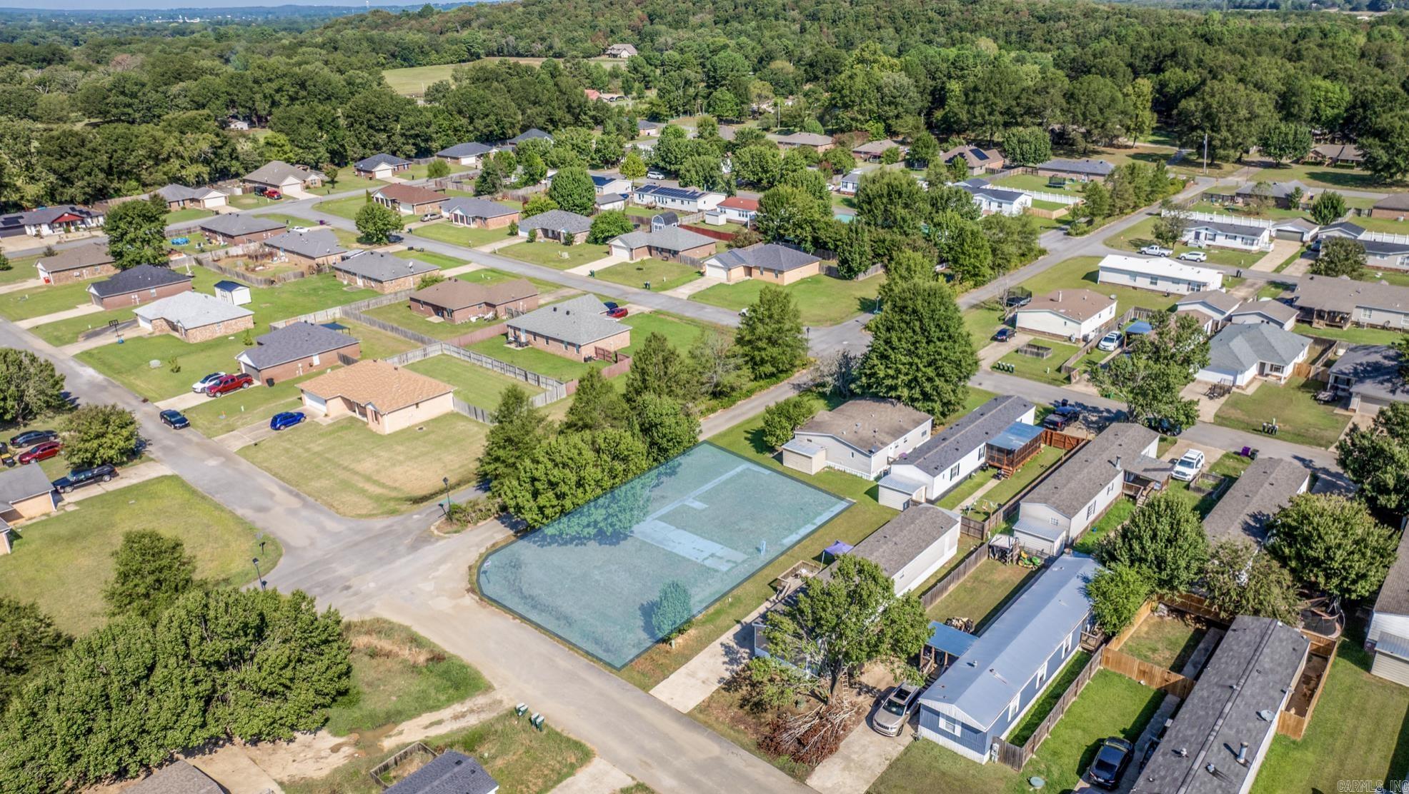 Great spot to build your new home! Vacant lot available in this established subdivision in Conway! Previous mobile home moved 10+ years ago. Mobile / Manufactured homes are no longer allowed to be moved into subdivision. Concrete driveway and sidewalks are present.