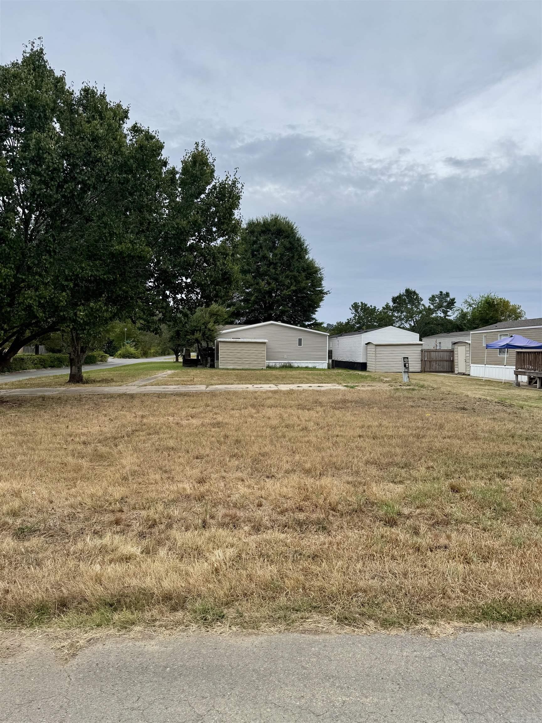 Great spot to build your new home! Vacant lot available in this established subdivision in Conway! Previous mobile home moved 10+ years ago. Mobile / Manufactured homes are no longer allowed to be moved into subdivision. Concrete driveway and sidewalks are present.