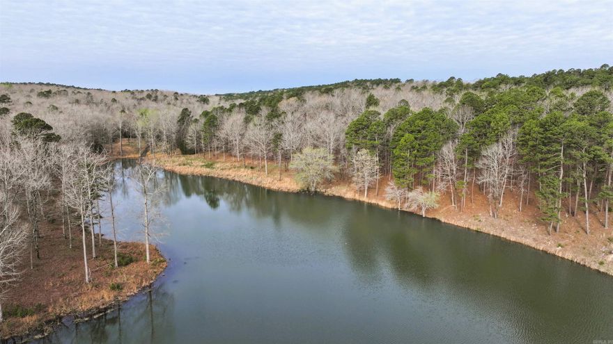 Experience the ultimate blend of secluded luxury and modern convenience at Bourbon Hollow, an 87-acre oasis situated on Ross Hollow Road. Located just minutes from the heart of West Little Rock, this expansive property offers a diverse landscape characterized by a beautiful mix of natural and planted timber set across rolling hill terrain. The centerpiece of this retreat is a private 3.6-acre lake teeming with bass, providing an immediate recreational escape for the avid angler or a serene backdrop for a future lakeside residence.  This premier acreage is perfectly suited for a significant private estate or the development of multiple homesites, offering a rare "best of both worlds" lifestyle. While the property feels worlds away from the city, it remains remarkably connected; you are only 20 minutes from the Cantrell Road Walmart and 24 minutes from Little Rock Christian Academy. Sharing the neighborhood with the renowned Moss Mountain Farm and positioned just minutes from the outdoor adventures of Lake Maumelle and Pinnacle Mountain State Park, Bourbon Hollow represents a unique opportunity to build a legacy in one of Central Arkansas's most sought-after rural corridors.