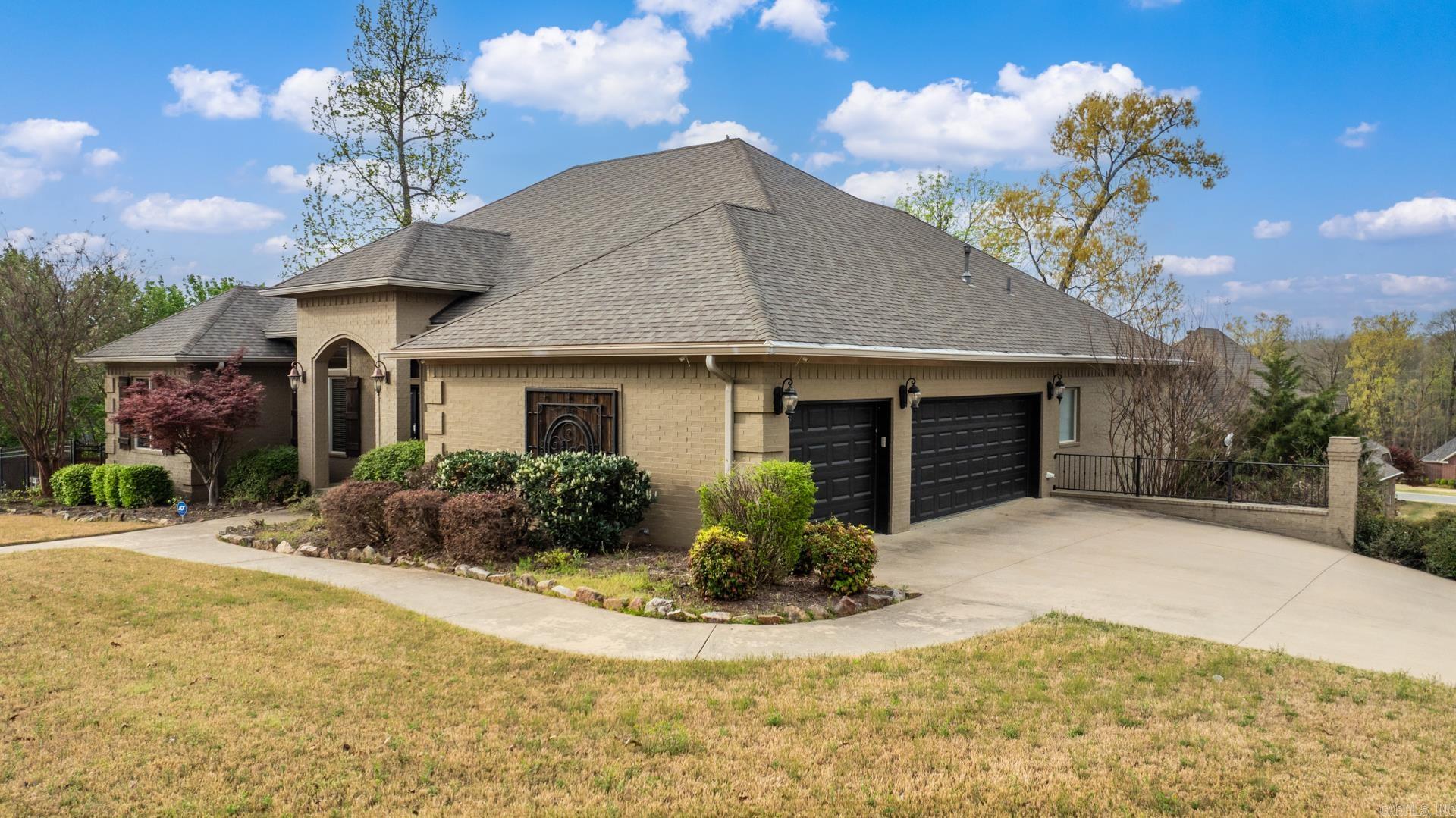 Fabulous corner lot that features a large custom home. Beautiful gourmet style kitchen with gas cooktop & slate tile floors. This home is basically 2 homes in one! You will enjoy the private master bedroom that features a large tub and oversized shower. and closet Another 3 bedrooms are on main level along with 2 more full baths. and two separate living areas, office and dining room. Downstairs you will enjoy a small kitchen, pantry, 2 bedrooms/multi-purpose rooms that open to large backyard. The oversized, side load garage is perfect for all of your cars and mowers. Upper deck and large lower patio surrounded by large fenced in yard. The outside areas are perfect for entertaining. WELCOME HOME!!!