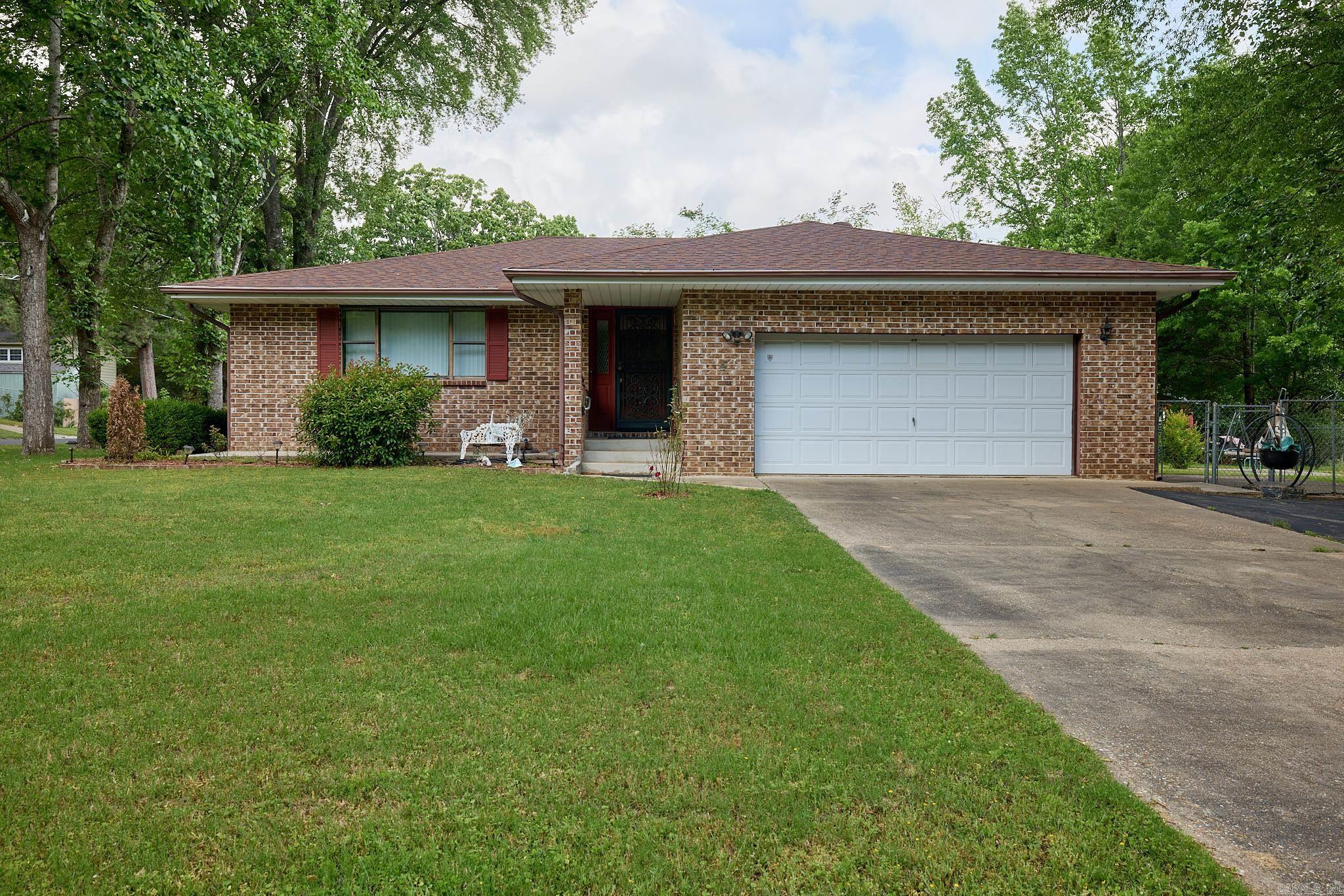 This spacious home on corner lot, with ample parking and flex space is a must see! Convenient location near all that Hot Springs has to offer!