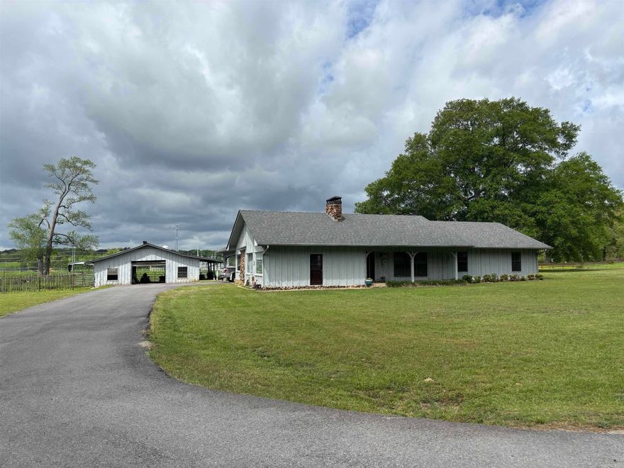 Bring your horses or 4H animals to this very comfortable ranch style home on over 3 acres*private convenient location on the edge of town*three or four bedrooms*two full baths*over 2500 square feet*beautiful rock fireplace*quartz counters in the kitchen with lots of birch cabinets*original owner home in mint condition*huge living room, 23x22 bonus room and a nice office*the owner handpicked the Heart Cypress on this home and handmade a lot of the trim work inside and out*extra insulated including interior walls for privacy*extra wide foundation footings with heavy rebar and walls are bolted to slab every few feet for extra structural integrity*granite counters in both bathrooms*nice 34x30 horse barn with 8x30 lean to*barn has four stalls and a large tack room*two of the stalls have 50' run outs*roof on house and barn done in 2025*