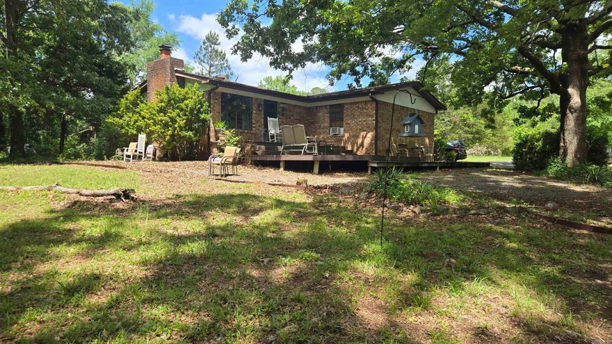 This is 2 homes on 2.65 acres Main home is Approx. 1232 Sqft . 2 bedroom 2 bath with Arkansas Room  and wood fireplace. Second living Space is detached from Main home is a 2 bedroom 1 bath home with a 1 car garage with  storage area. Also a work shop Approx 12x12.  City water  In fountain lake school district Its a must see!! Call or Text Angela Garrett @ Hot Springs Village Real Estate for Appointment 501-209-1243