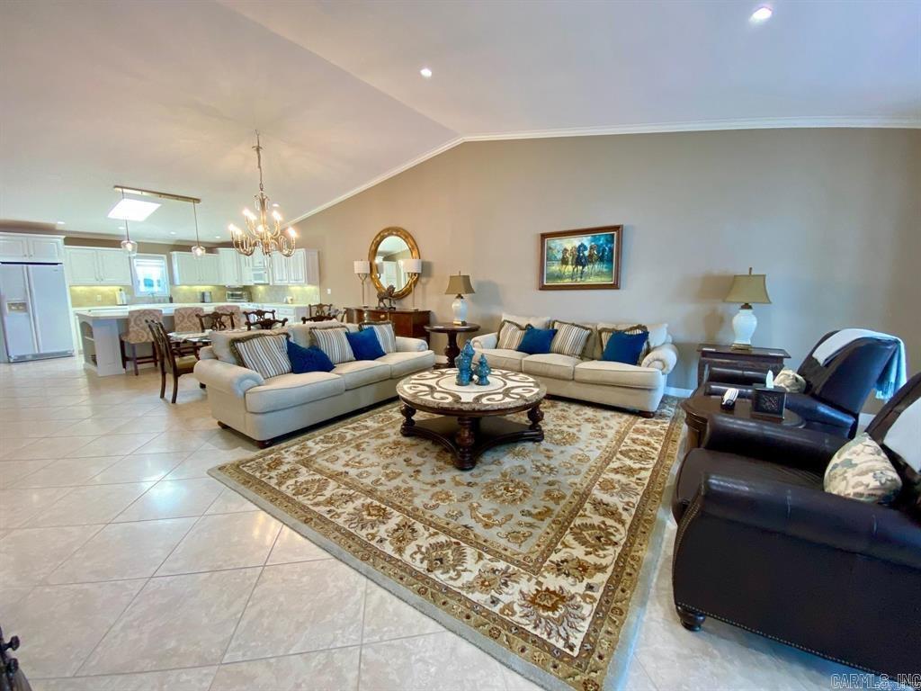 Two Beautiful Lake front Condos for the price of one !!! Fantastic location within a gated community directly on Lake Hamilton. Short Drive to Oaklawn, restaurants and the marina. This unique property offers a 2 bed 2 bath penthouse condo and a 1-bed studio condo, all included in the price. And all exquisite furnishings included! The penthouse is approximately 1800Sq feet with vaulted ceilings, open floor plan and amazing views from the large balcony. Large wet bar, open floor plan and fireplace. The oversized Covered patio with table, BBQ, large sectional offers amazing views of the lake that will not disappoint. A walk in level studio unit on the bottom level with around 400 sq ft., kitchenette & bath. The patio is right on the waters edge. Boat slip with upgraded lift. Community Pool. Many updated have been completed recently included updates to the pool, docks, painted exterior, landscaping, carpet in common areas. Check all what this listing has to offer! A turn key property ! Min 90 Day Rentals allowed. 325 HOA fees include both condos.