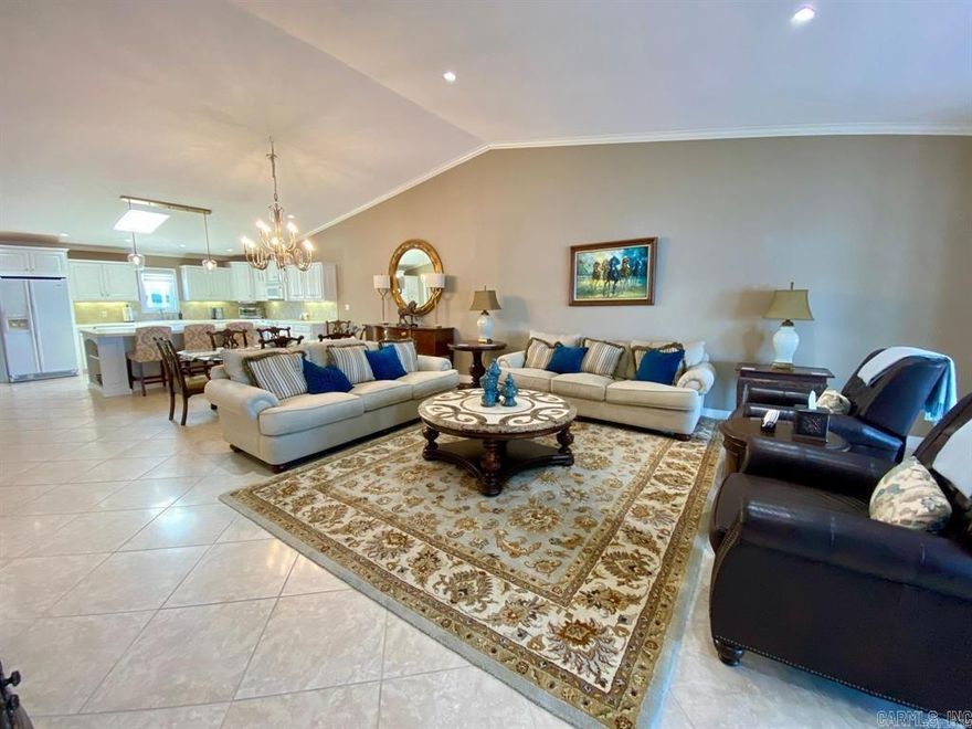 Two Beautiful Lake front Condos for the price of one !!! Fantastic location within a gated community directly on Lake Hamilton. Short Drive to Oaklawn, restaurants and the marina. This unique property offers a 2 bed 2 bath penthouse condo and a 1-bed studio condo, all included in the price. And all exquisite furnishings included! The penthouse is approximately 1800Sq feet with vaulted ceilings, open floor plan and amazing views from the large balcony. Large wet bar, open floor plan and fireplace. The oversized Covered patio with table, BBQ, large sectional offers amazing views of the lake that will not disappoint. A walk in level studio unit on the bottom level with around 400 sq ft., kitchenette & bath. The patio is right on the waters edge. Boat slip with upgraded lift. Community Pool.   Many updated have been completed recently included updates to the pool, docks, painted exterior, landscaping, carpet in common areas. Check all what this listing has to offer! A turn key property !  Min 90 Day Rentals allowed.  325 HOA fees include both condos.