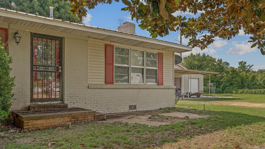 A rare find in Trumann  three parcels sold together featuring a home, a shop, and an additional vacant lot. The residence offers 2,128 sq ft with 3 bedrooms and 2 bathrooms, including new flooring in the den and a brick fireplace as the centerpiece. A large spacious shop provides ample space for projects or storage, and the extra lot adds flexibility for future use