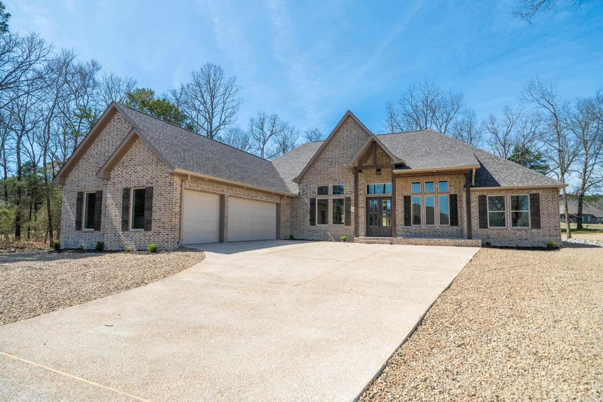 New Construction Isabella Golf Course Experience refined golf-course living in this new construction contemporary home ideally positioned on a level lot along the Isabella Golf Course in Hot Springs Village. Designed with both style and function in mind, this residence offers sweeping golf course views and a seamless indoor–outdoor connection. High-end finishes and attention to details define the upscale aesthetic, while thoughtfully designed living spaces provide comfort and flexibility for everyday living or entertaining. Expansive windows frame fairway views and flood the home with natural light, enhancing the open-concept layout. The kitchen features premium materials, custom cabinetry, and upscale fixtures, complementing the home’s upscale design. Quality craftsmanship is evident throughout, from the curated finishes to the efficient floor plan that maximizes the level setting and golf-front location. Enjoy the tranquility of golf-course living with the convenience and amenities of Hot Springs Village, including multiple golf courses, lakes, trails.  Taxes are based on unimproved lot, consult the county assessor for taxes with home constructed.